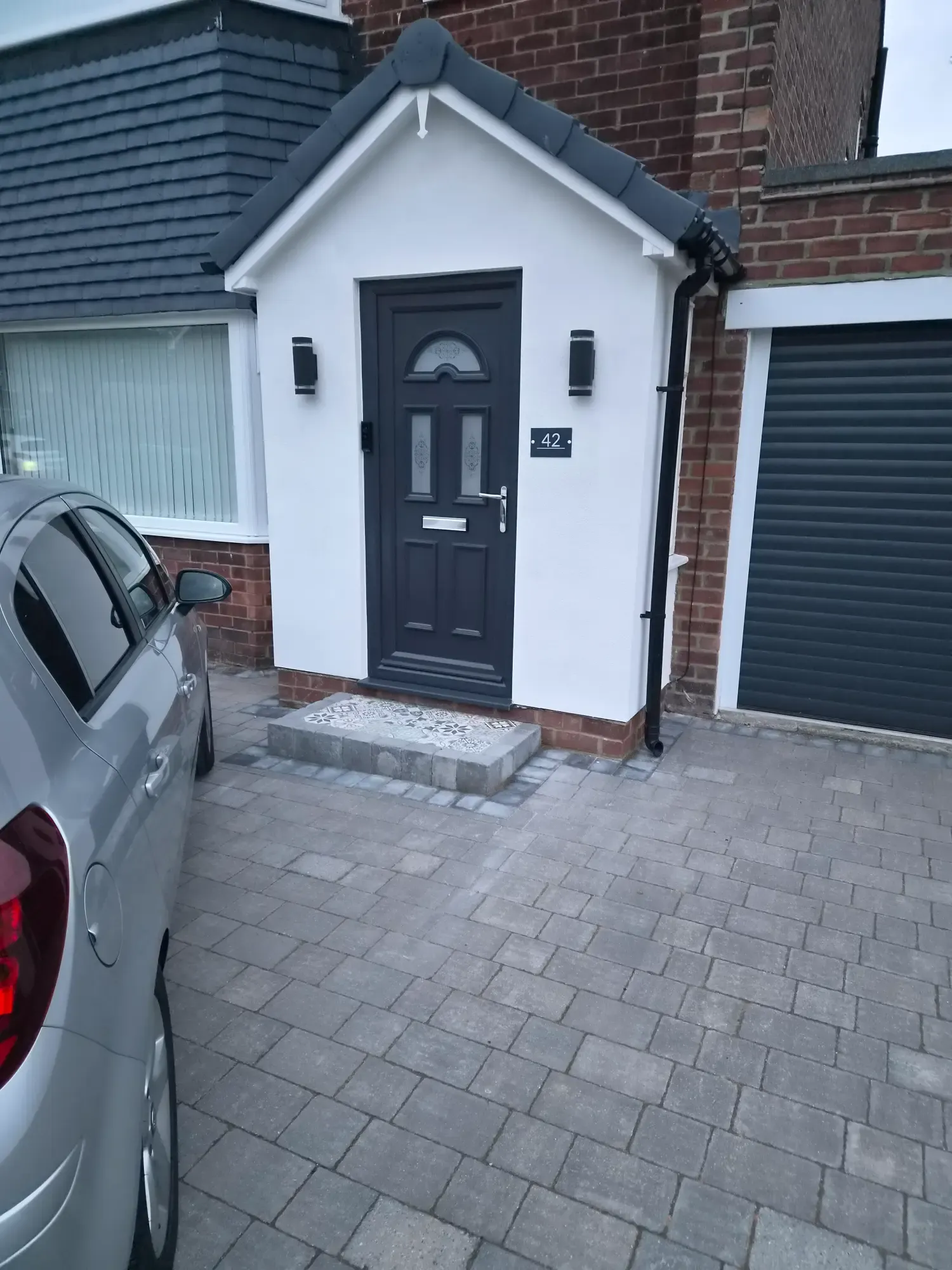 Finished white render porch in Whitley Bay
