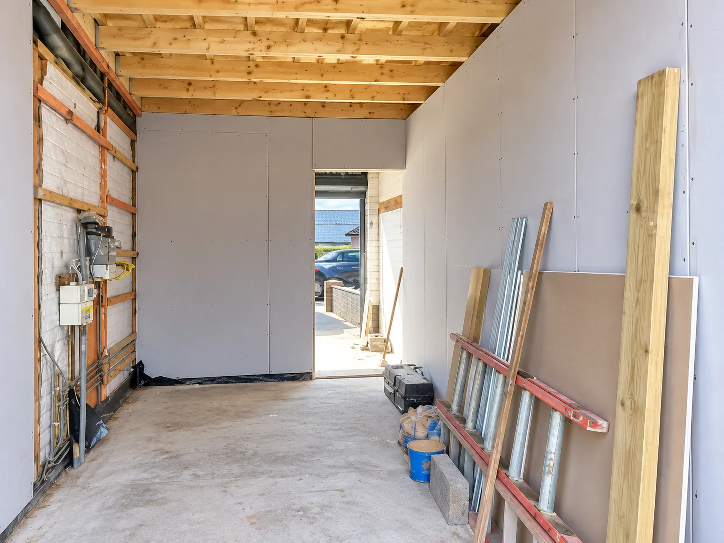 Garage conversion in progress with new ceiling joists and plasterboard in Whitley Bay